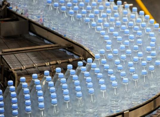 Bottles move down a conveyor belt at the Evian mineral water plant in Amphion-les-Bains, France. Photograph by Jean-Pierre Clatot, AFP/Getty Images